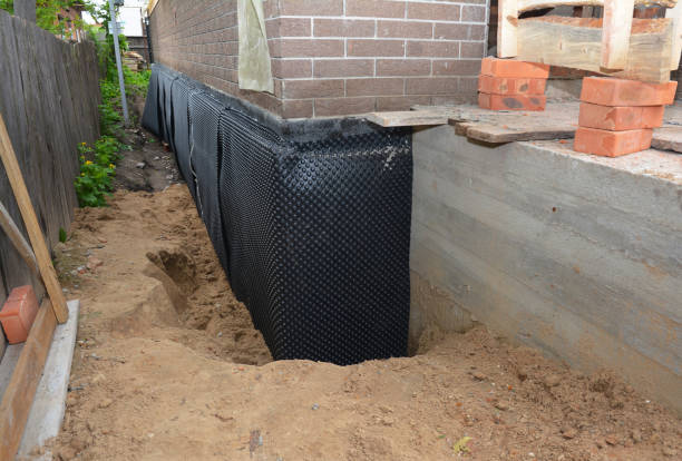 Happy homeowners after waterproofing job in Round Hill